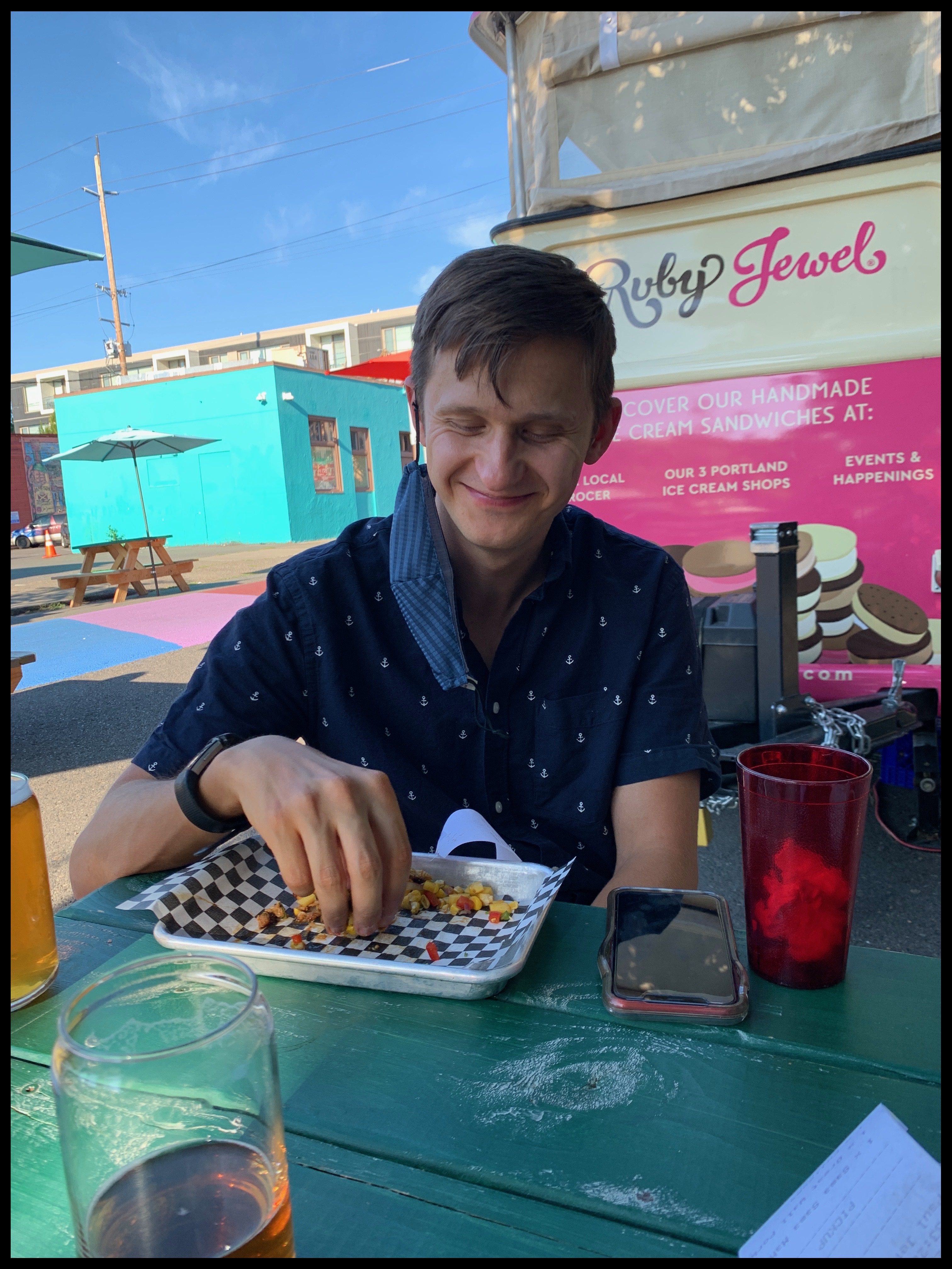 Ross Grynko enjoying food and beers with a friend in Portland, Oregon
